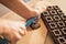 Woman hands chopping chocolate block for celebratory cake