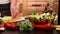 Woman hands chopping cucumber slices for a vegetables salad