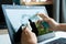 Woman hands cleaning laptop screen with disinfectant wet wipe. Concept of disinfecting surfaces from bacteria or viruses. Close up