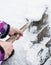 Woman hands clearing snow