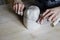 Woman hands close-up, forming crude clay in a potter`s workshop studio. Craft-workg.