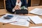 Woman hands counting euro money  with document home budget lapptop pen and calculator