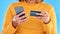 Woman hands, credit card and phone in studio for online shopping, digital fintech payment and customer money. Closeup