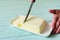 woman hands cutting butter on a lime wooden desk