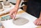 Woman hands doing pottery decor table