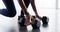 Woman, hands and dumbbell closeup gym or workout cardio training, muscle fitness or shoes. Female person, legs or active