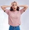 Woman with hands on head, surprise and stress, reaction in portrait with disaster isolated on white background. Crisis