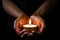 Woman hands with henna holding colorful clay diya lamps lit during diwali celebration