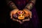 Woman hands with henna holding colorful clay diya lamps lit during diwali celebration