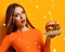 Woman hands hold big burger barbeque sandwich with beef and lit candle for birthday party on yellow