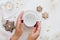 Woman hands hold empty white cup. Christmas gingerbread