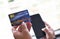 Woman hands holding credit card and using smartphone for online shopping / people paying technology money wallet online payment at