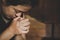 Woman hands holding crucified cross while praying God