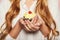 Woman hands holding a delicious yummy cupcake