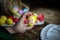 Woman hands is holding eggs with floral patterns. Preparing for Easter. Artist paints an Easter egg. Close-up. Selective focus.