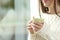 Woman hands holding a hot coffee cup in winter