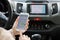 Woman hands holding iPhone 6S with application Taxi Uber