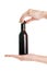 Woman hands holding small wine bottle. Isolated with clipping pa