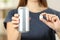 Woman hands holding a soda drink can and a sugar cube