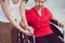 Woman hands holding to asian mature sitting on wheelchair,Take care and suport,Senior insurance concept