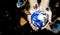 Woman hands holding world or globe with butterfly on earth day.Environment conservation and energy saving concept.Elements of this