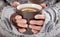 Woman hands with hot drink