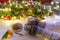 Woman hands ith cup of hot chocolate on christnas tree background