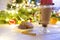 Woman hands ith cup of hot chocolate on christnas tree background