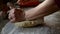 Woman hands kneading dough for a cake