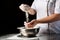 Woman hands kneading dough close up