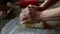 Woman hands kneading the dough for a roll cake