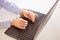 Woman hands locked to laptop by chain on keyboard of notebook