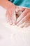 Woman hands mixing flour on the table