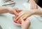 Woman hands in a nail salon receiving a  hand massage by a beautician. SPA manicure