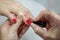 Woman hands in a nail salon receiving a manicure by a beautician