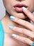 Woman hands nails manicure fashion blue jewelry. Female hands wi