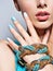 Woman hands nails manicure fashion blue jewelry. Female hands wi