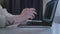 Woman hands near keyboard notebook at table. Close up female hands using laptop for remote work. Modern student laptop