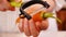 Woman hands peel fresh carrot - close up, camera slide