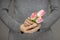 Woman hands with perfect nail art holding pink spring flowers tulips, sensual studio shot