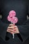 Woman hands with perfect nail polish holding some pink and white lollypops