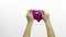 Woman hands playing oddly satisfying purple slime. White background. Antistress