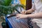 Woman hands plays the guzheng, Chinese traditional stringed musical instrument close up, Asian culture