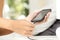 Woman hands plugging a charger in a smart phone