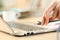 Woman hands plugging ethernet cable on laptop