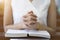 Woman hands praying on a holy bible in church for faith concept, Spirituality and Christian religion