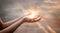 Woman hands praying for on sunset background