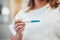 Woman hands pregnancy test and reading for results, information or notification for baby in home. Girl, test and reading