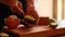 woman hands preparing avocado for eat closeup on wooden board at home