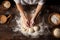 Woman hands preparing dough top down view